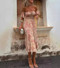 Tilda - Elegant volangklänning med off-shoulder design